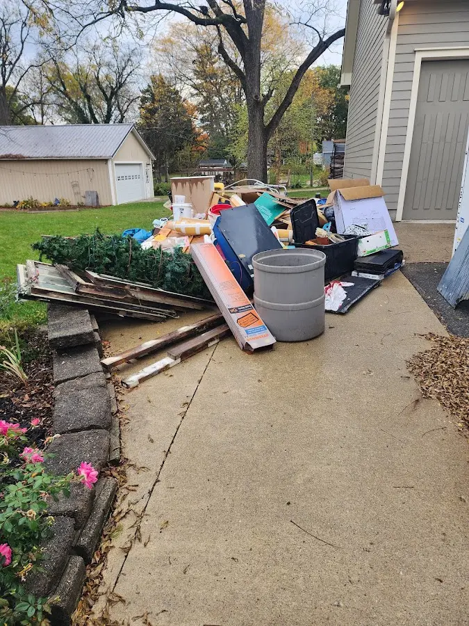 Dumpster being loaded with debris for Commercial Dumpster Rental in Oxnard